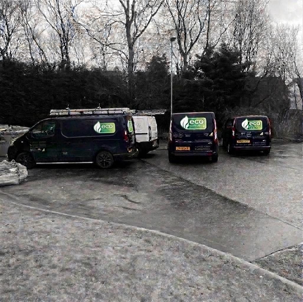 Our branded plumbing and heating vans lined up on a Greater Manchester job